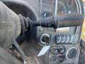 Close-up of the controls of a 2013 JCB 510-56 Loadall showing levers and buttons for operation