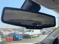 Rearview mirror of a 2017 Chevrolet Colorado displaying buttons for various features