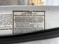 Label on a 2002 Ford Econoline detailing weight distribution and payload certification information