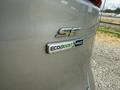 A close-up of the rear badge of a 2015 Ford Escape displaying the SE and EcoBoost AWD labels