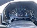 Dashboard of a 2015 Ford F-150 showing speedometer and other gauges with the gear indicator set to drive