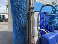 A 2023 Bitimec SC415 with a large blue brush and hoses attached, designed for cleaning outdoor surfaces