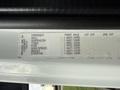 A label detailing specifications and weight limits for a 2015 Freightliner M2 including components like axle suspension tires rims hubs brakes and steering