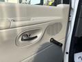 Interior door panel of a 2008 Ford Econoline featuring a handle and a speaker grille