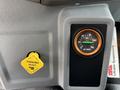 Dashboard of a 2019 Ford F-750 featuring a parking brake control and an air pressure gauge