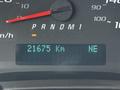 2021 Chevrolet Express dashboard showing a speedometer and an odometer reading 21675 Km with a gear indicator and north-east direction indicator