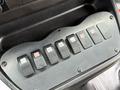 A panel with six switches used for various controls in a 2015 Chevrolet Express vehicle