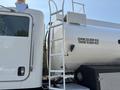 A 2008 Peterbilt 340 truck with a metallic tank attached featuring specifications for gross vehicle weight and tare weight displayed on its side