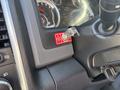 Image shows the dashboard of a 2014 RAM 5500 featuring a key ignition with a warning sticker and gear shift lever