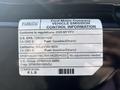 A label detailing vehicle emission control information for a 2025 Ford Transit T-350 including fuel type and compliance with environmental regulations