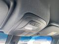 Interior view of a 2025 Mercedes-Benz Sprinter showing the overhead control panel with buttons and lights
