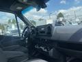 Interior view of a 2025 Mercedes-Benz Sprinter showing the dashboard steering wheel and center console