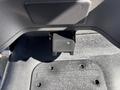 A close-up view of a black plastic control panel or module underneath the dashboard of a 2019 Freightliner M2 106