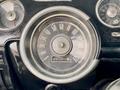 Dashboard of a 1968 Ford Mustang Two Door Convertible featuring a round speedometer with dials for speed and oil pressure