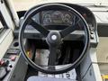 The interior dashboard and steering wheel of a 2016 Grande West Vicinity bus showing gauges and controls