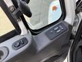 View of the control panel inside a 2011 International 7500 truck featuring buttons for window controls and mirrors
