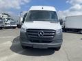 A 2024 Mercedes-Benz Sprinter van with a white front and a prominent Mercedes logo on the grille