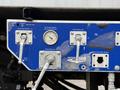 Control panel of a 2013 International Workstar 7500 showing valves and pressure gauge for air and water systems