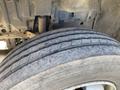 Close-up of a tire from a 2014 Hino 195 showing tread patterns and wear on the rubber surface