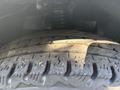 Close-up of a tire with detailed tread patterns from a 2021 Mercedes-Benz Sprinter 2500 showing wear and texture