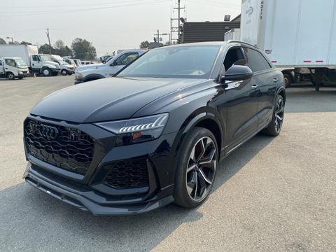 A 2020 Audi RS Q8 in black with a bold front grille and sporty design featuring large alloy wheels and aggressive lines