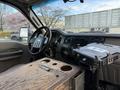 Interior view of a 2008 Ford F-450 with a wooden center console and dashboard controls visible
