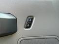 A close-up view of the door lock buttons on a 2022 Ford F600's interior panel