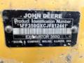 A close-up of a yellow identification plate on a 2018 John Deere 350 excavator displaying the product identification number and brand information