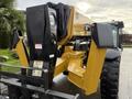 A 2014 Caterpillar TL1055C telehandler with a yellow boom and a black chassis featuring large tires and a front attachment for lifting and moving materials