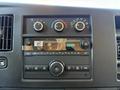 Dashboard of a 2024 Chevrolet Express showing audio controls and climate settings with various buttons and knobs displayed
