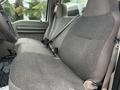 Interior view of a 2008 Ford F-550 showing fabric-covered front seats with seat belts and a steering wheel in the foreground
