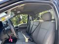The interior of a 2022 Ford F-350 SD featuring a spacious front cabin with gray fabric seats and a black steering wheel