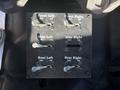 A control panel with six toggle switches labeled Front Left Front Right Side Left Side Right Rear Left Rear Right with positions marked OFF and ON