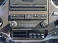 Dashboard control panel of a 2018 Ford F-750 with climate controls and auxiliary switches