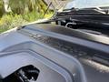 Close-up of the engine cover of a 2020 Ram 2500 displaying the embossed "RAM" logo and the word "HEAVY DUTY"