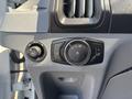 Control panel featuring knobs and buttons for lights and other functions in a 2019 Ford Transit 350