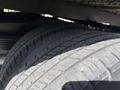 Close-up of the tires of a 2023 Ford E-450 showcasing their tread pattern and rubber surface