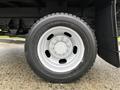Close-up of a black tire with a white rim mounted on a 2008 Sterling Bullet vehicle