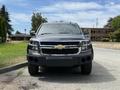 Front view of a black 2017 Chevrolet Tahoe with a chrome grille and prominent headlights