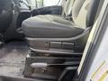A fabric driver's seat in a 2017 RAM Promaster with adjustable controls and a sturdy base