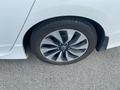 Close-up view of a 2017 Honda Accord Hybrid tire featuring multi-spoke alloy rim with a Honda emblem and the tire brand TrueContact