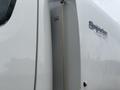 A 2006 Freightliner M2 106 truck displaying its side with a label reading Superato and contact number 9283082661