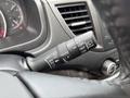 A close-up of the wiper control stalk in a 2014 Honda CR-V with various settings labeled for mist, off, intermittent, and rear wipers