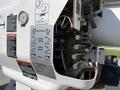 Close-up of the mechanical controls and warning labels on a 2008 International 7500 showcasing various buttons and levers for operation