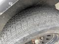 A close-up of a tire from a 2005 Katolight SED60FPJ4 showing detailed tread patterns and sidewall markings