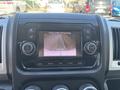 Dashboard of a 2020 RAM ProMaster 3500 featuring a central display screen with a rearview camera view and control knobs for audio and settings