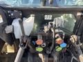 Close-up of the control panel of a 2010 New Holland T4050 tractor featuring various levers and hydraulic connections in a worn condition