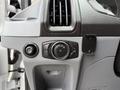 Dashboard controls of a 2018 Ford Transit including knobs for lights and ventilation settings