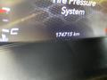 A 2019 Dodge Charger dashboard displaying the tire pressure system and a mileage reading of 174715 km
