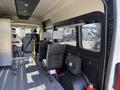 Interior view of a 2021 RAM Promaster van featuring two front seats and two rear seats along with a storage area on the left